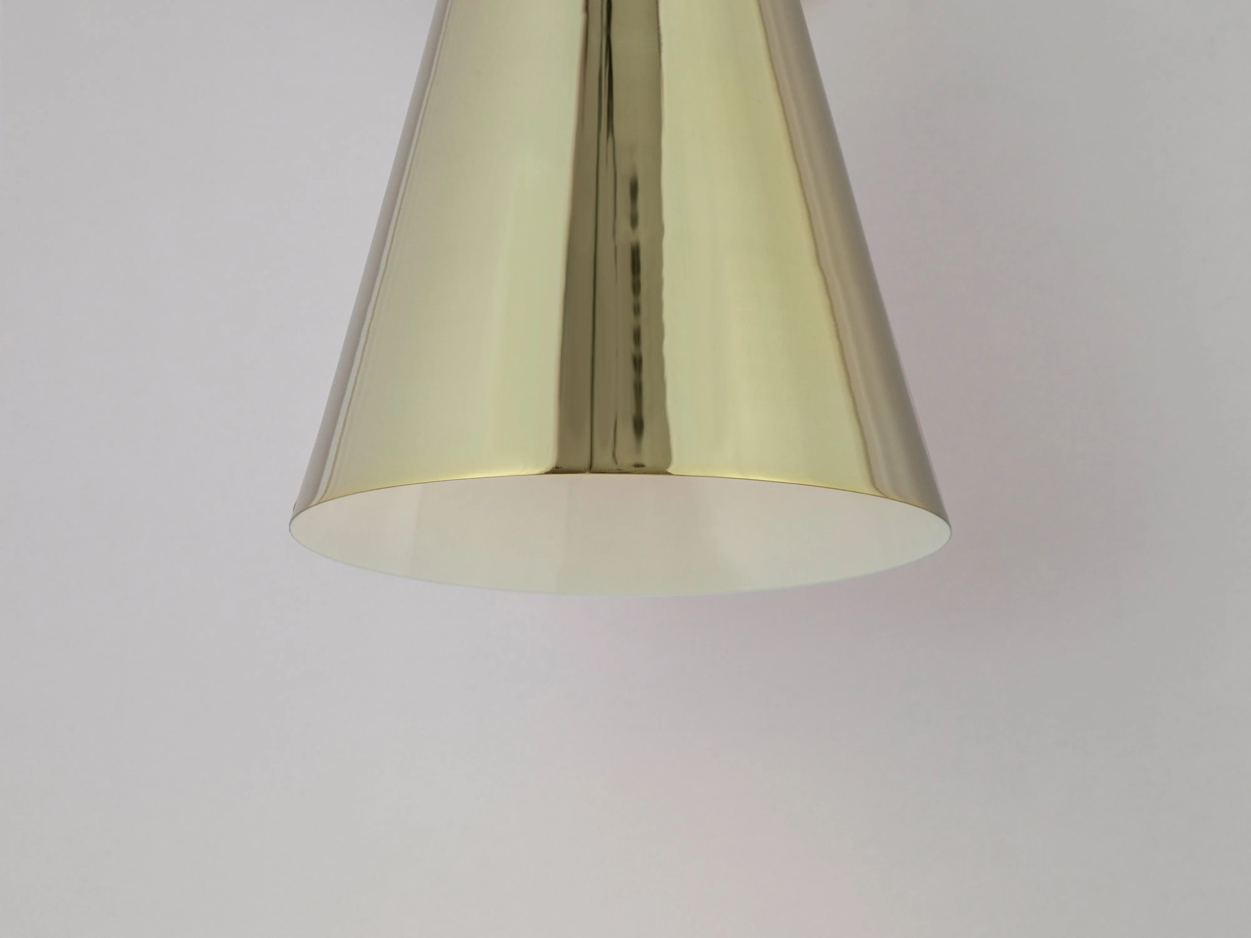 Brass cone shade wall light