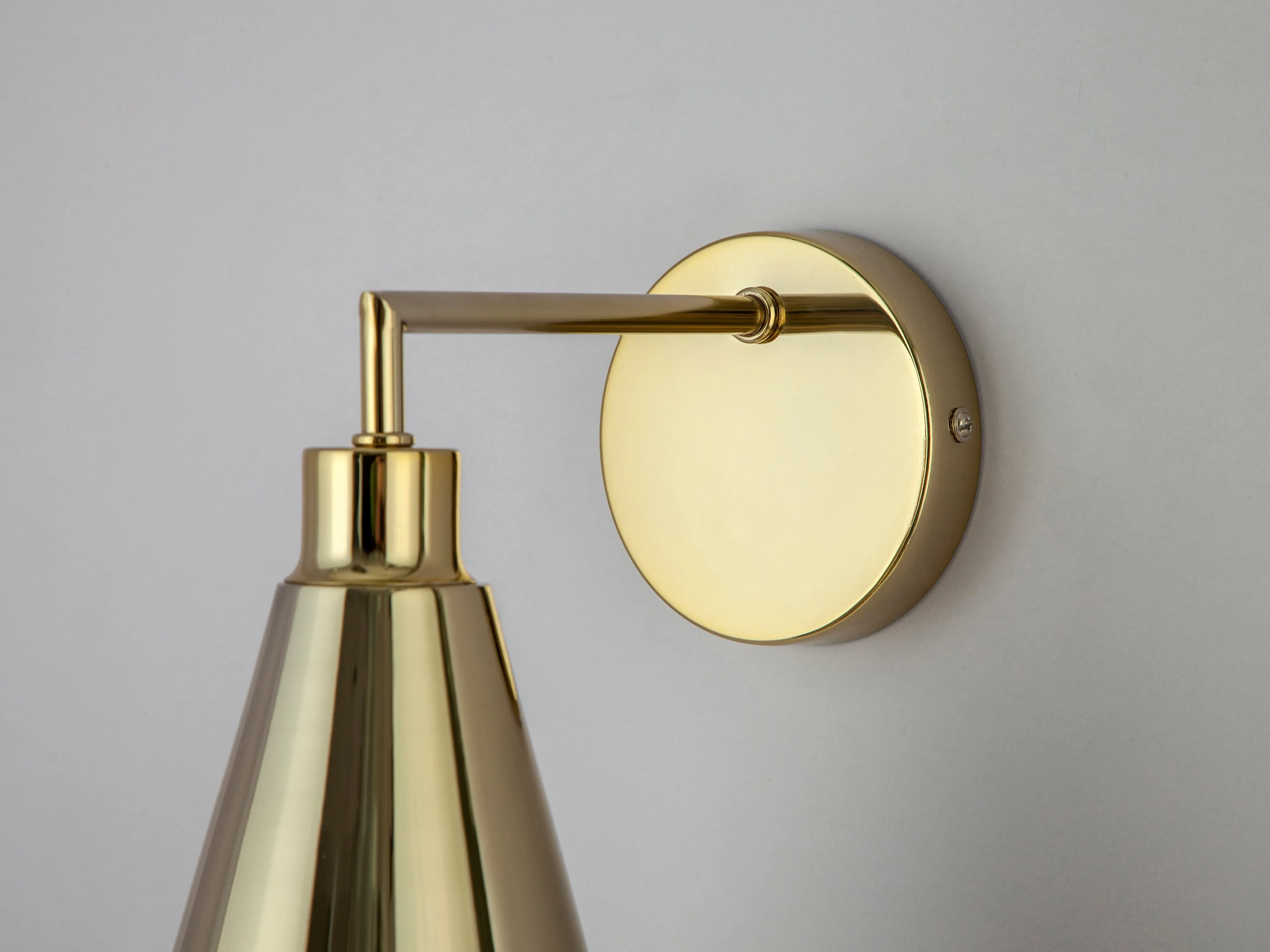 Brass cone shade wall light