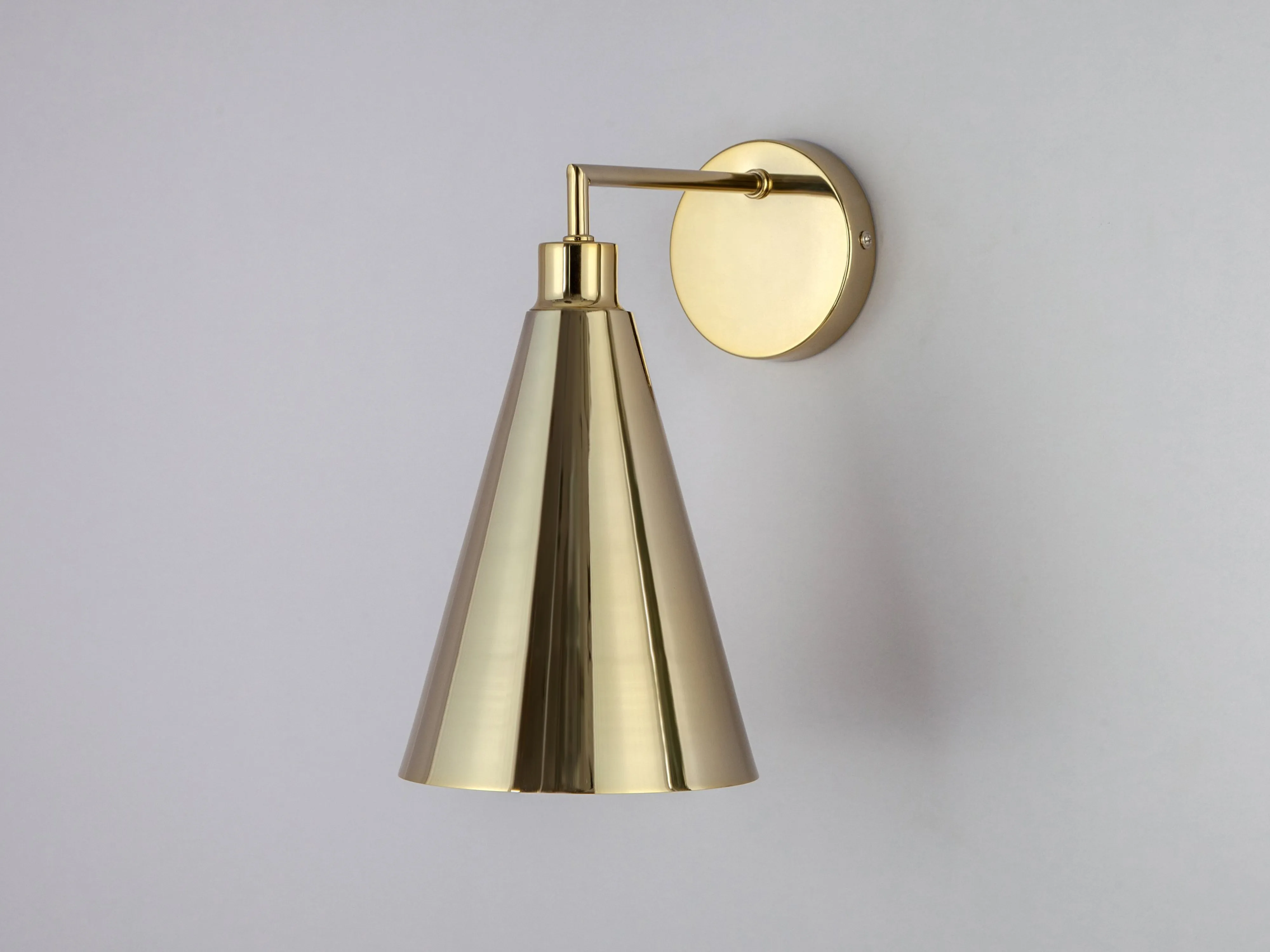 Brass cone shade wall light